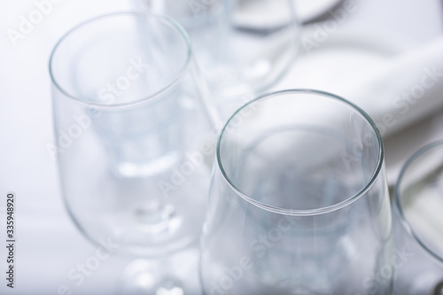 A view of several wine glasses on a restaurant table.
