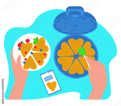 Vector flat illustration waffle iron, hands that prepare and hold plate of waffles and berries. There is also mobile phone with recipe. Concept kitchen appliances, recipes online, cooking, pastry.