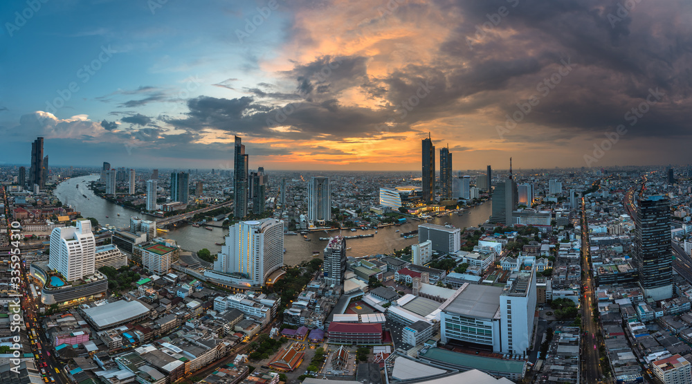 Fototapeta premium Scenic view curved of the Chao Phraya River in Bangkok city downtown at sunset, capital of Thailand