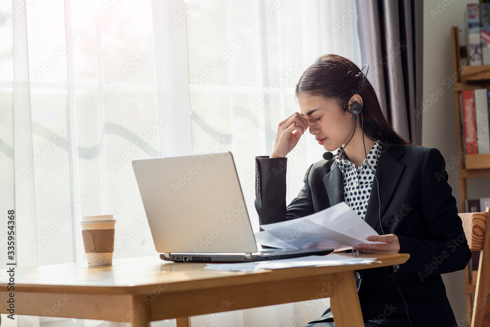 Stressed business Asian woman with palm on face in her office Stressed business Asian woman with palm on face in her office