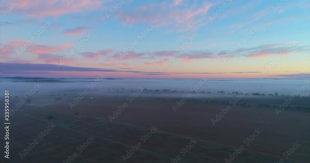Cinematic 4k Aerial Video of a foggy Sunrise over a Farm Cinematic 4k Aerial Video of a foggy Sunrise over a Farm