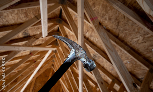 Hammer with house rafters  © Lynn Freeny