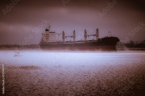 фотографія Cargo Container Ship Sails into a Ghastly Encounter