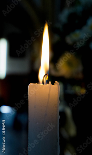 Burning candle at chrch photo