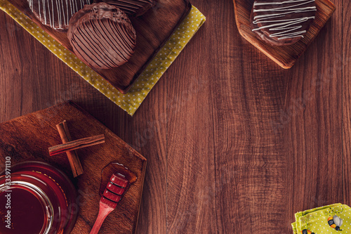 Top view of honey cookie chocolate covered on the wooden table with copy space - pão de mel