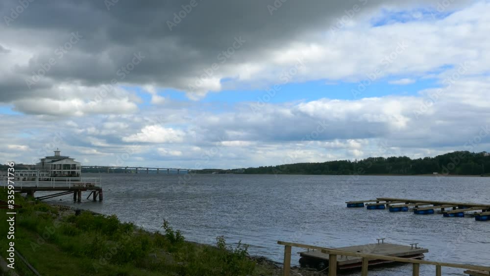 Long shot of the Volga river in Kostroma Russia on a cloudy day with blue sky Long shot of the Volga river in Kostroma Russia on a cloudy day with blue sky