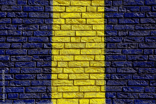 Colorful background and texture depiction of country flag on a brick wall.  photo