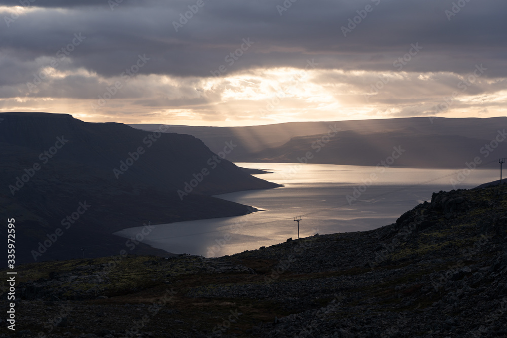Fjord illuminated by sunset in Westfjords Iceland Fjord illuminated by sunset in Westfjords Iceland