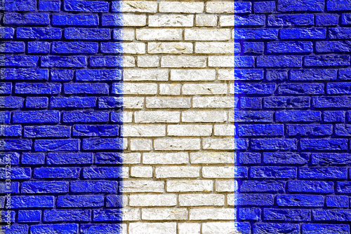 Colorful background and texture depiction of country flag on a brick wall. 