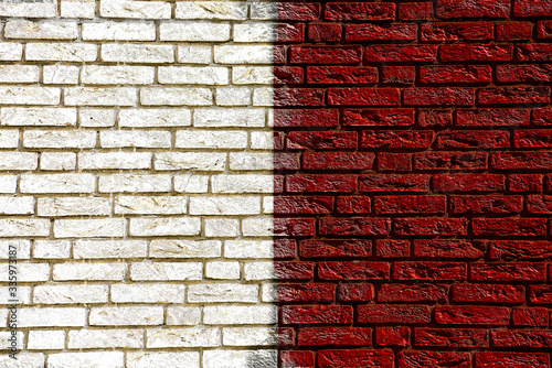 Colorful background and texture depiction of country flag on a brick wall. 