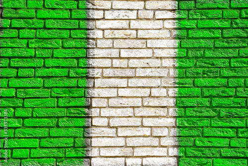 Colorful background and texture depiction of country flag on a brick wall. 