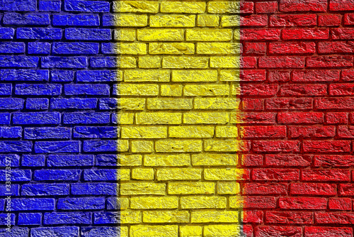Colorful background and texture depiction of country flag on a brick wall. 