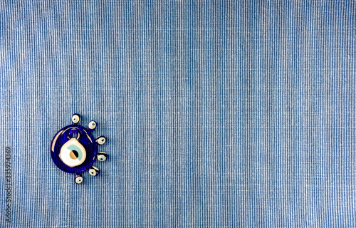 Pretty Turkish evil eye pendants isolated against a white background photo