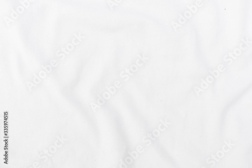 Abstract white fabric texture background. Wavy white cloth.