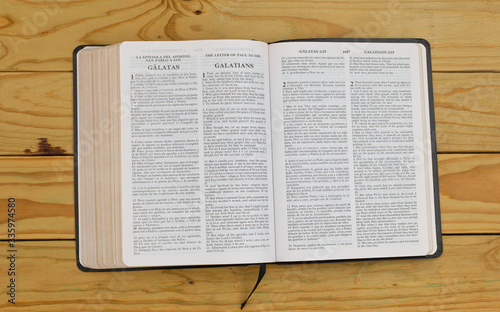 open bilingual bible book on Galatians, Spanish and english  photo