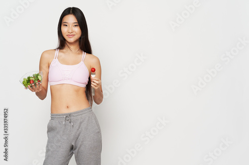 young woman holding a scale © SHOTPRIME STUDIO