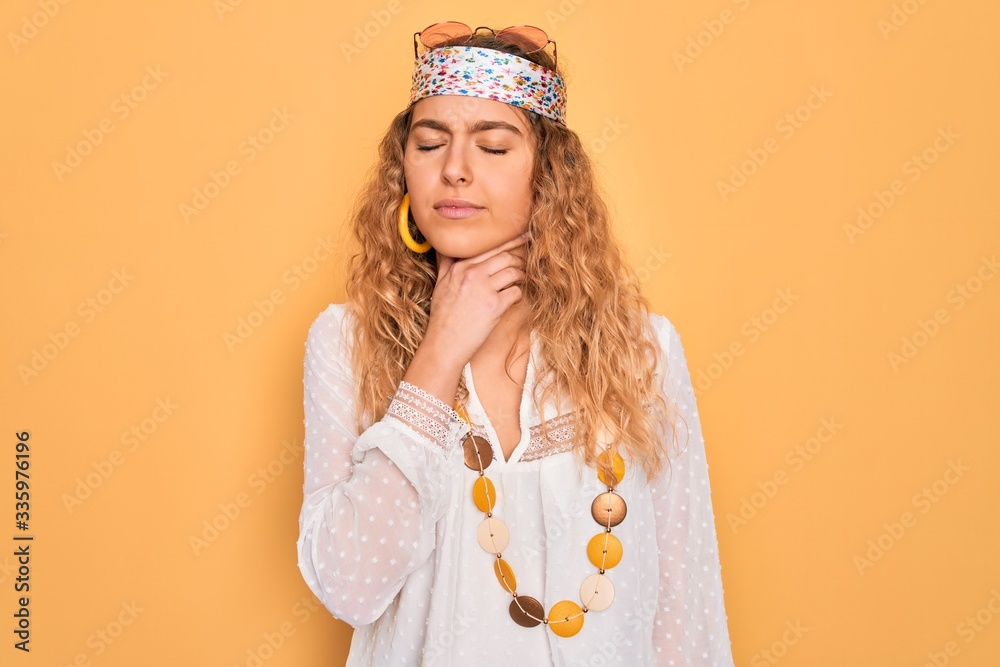Young beautiful blonde hippie woman with blue eyes wearing sunglasses and accessories Touching painful neck, sore throat for flu, clod and infection