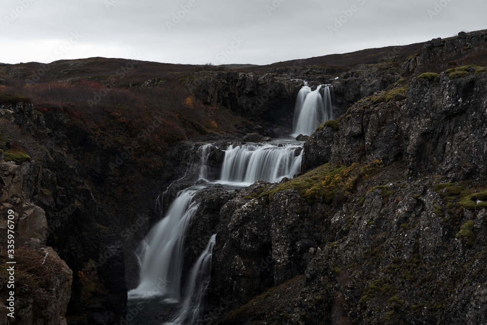Hidden waterfall in Icelandic Westfjords during autumn Hidden waterfall in Icelandic Westfjords during autumn