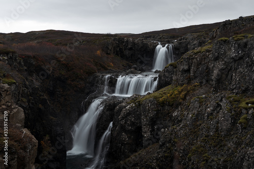 Hidden waterfall in Icelandic Westfjords during autumn