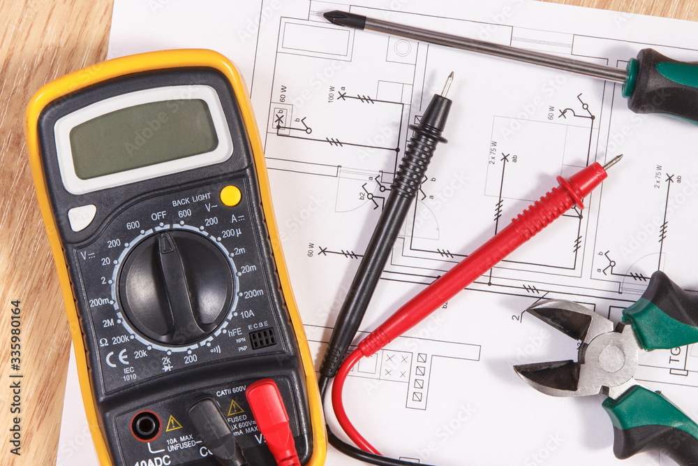 Electrical drawings, multimeter for measurement in electrical installation and accessories for use in engineer jobs Electrical drawings, multimeter for measurement in electrical installation and accessories for use in engineer jobs