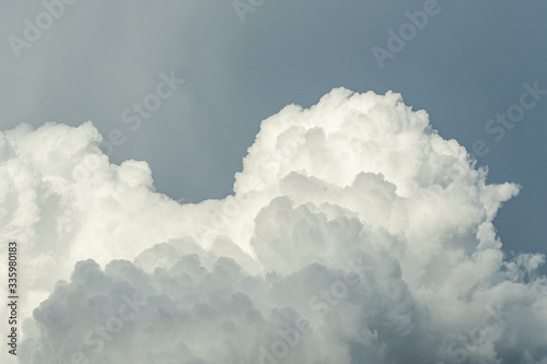 a huge cluster of fluffy cloudy under over cast sky after rain