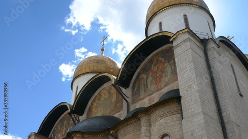 Right to left pan from Dormition Cathedral to Ivan the Great Bell Tower with a blue sky