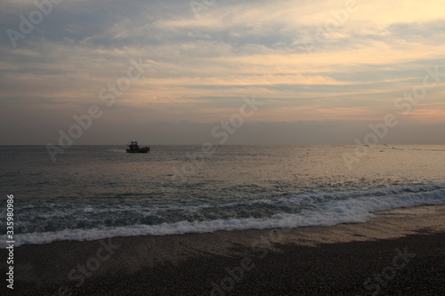 Long exposure sunrise seascape with Chinese fishing junks in the background