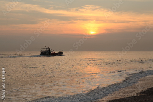 Long exposure sunrise seascape with Chinese fishing junks in the background © Jim