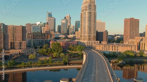 Aerial: downtown Minneapolis & Mississippi River at sunrise. Minneapolis, Minnesota, USA. photo