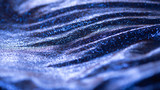 Sea wave like metallic and electric blue fabric with shiny reflective cracked surface