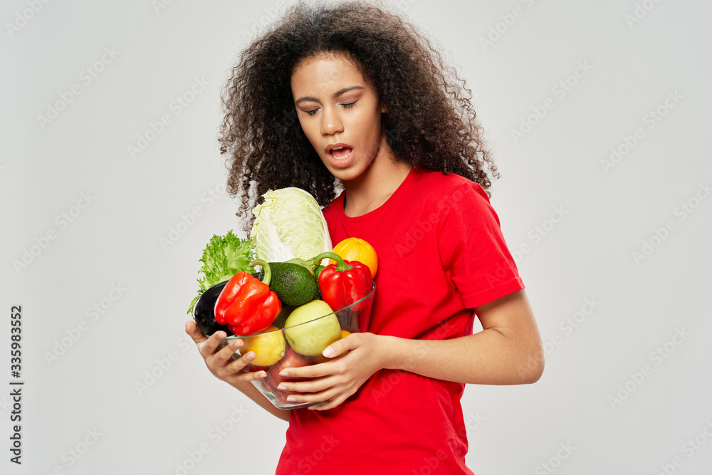young woman holding vegetables young woman holding vegetables