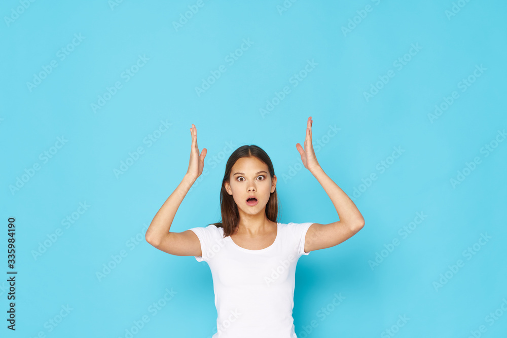 Fototapeta premium happy young woman with arms raised
