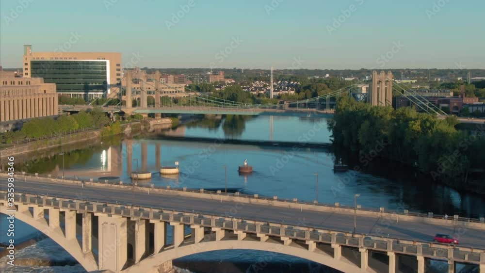 Aerial:car driving over Central Avenue Bridge over the Mississippi River at sunrise. Minneapolis. Minnesota, USA Aerial:car driving over Central Avenue Bridge over the Mississippi River at sunrise. Minneapolis. Minnesota, USA