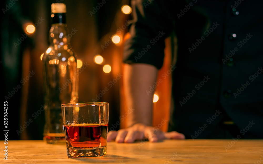 Barman pouring whiskey whiskey glass beautiful night