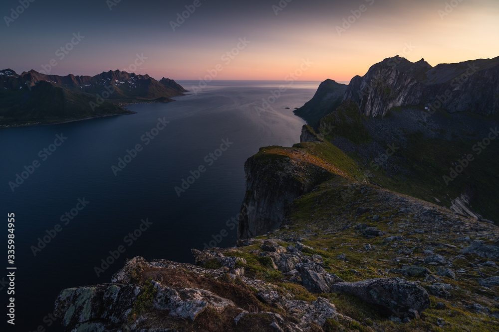 Midnight sun view from top of Hesten peak in Senja island in summer season, Nordland Norway, Scandinavia