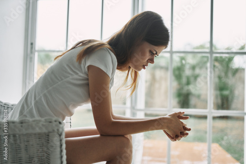 young woman looking out window Free Download young woman looking out window - GFXLoad