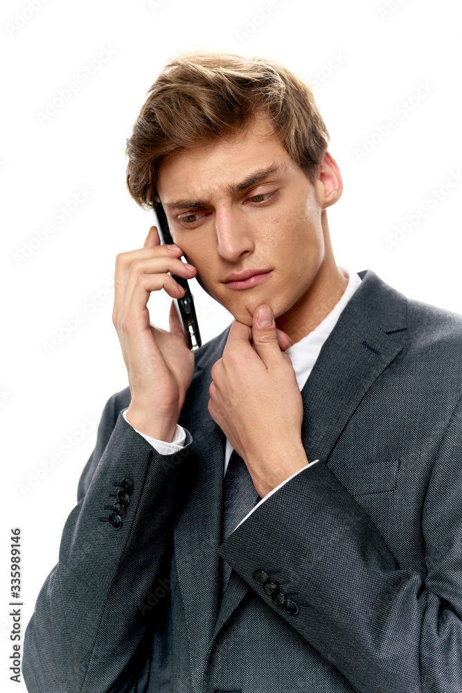 young businessman talking on the phone young businessman talking on the phone