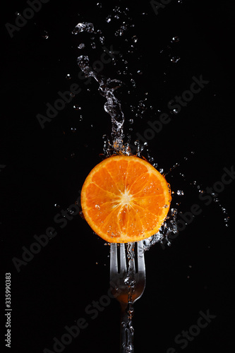 orange in water on a fork