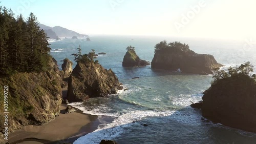 beautiful afternoon with soft light on the well known islands and rock features of Secret Beach in the southern Oregon coast 