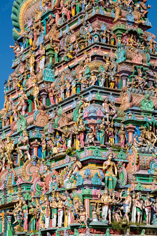Fototapeta premium Hindu temple in Tamil Nadu, South India. Sculptures on Hindu temple gopura (tower), sculpture of an Indian deity