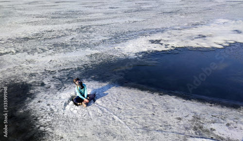 a girl in a gas mask on ice