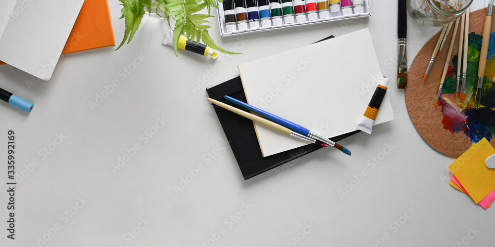 Top view image of Painter workspace. Stationary, Color palette
