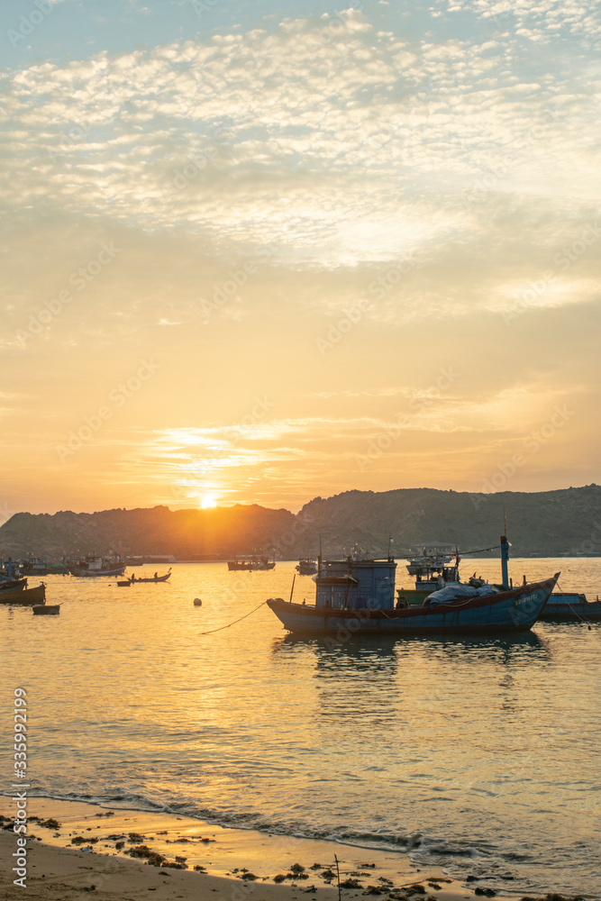 sunset with boat over the sea cat tien vietnam