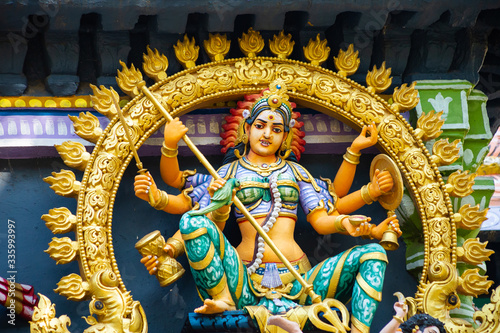 Hindu temple in Tamil Nadu, South India.  Sculptures on Hindu temple gopura (tower)
 photo