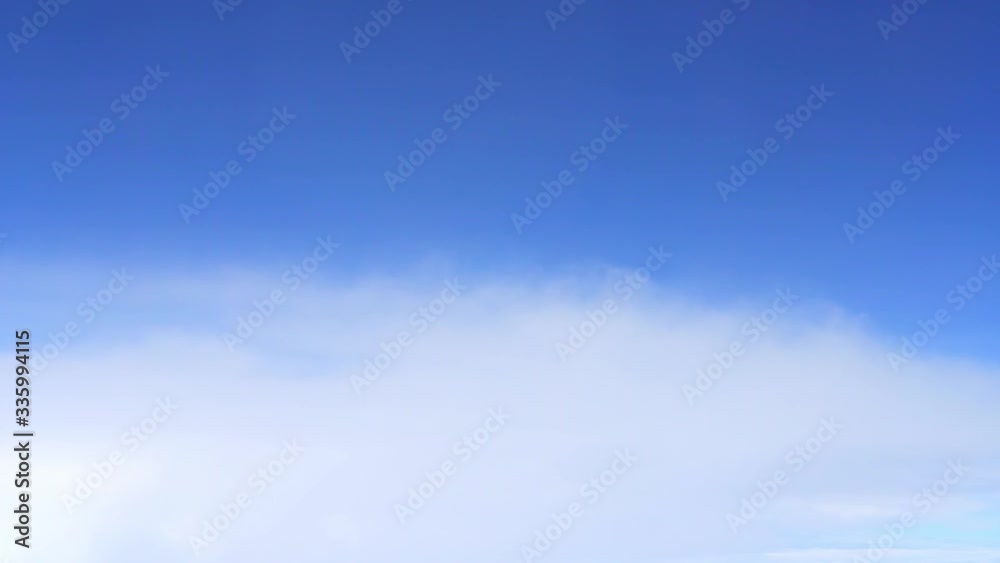 Aerial shot above the clouds in 4K, Flying through the cloud, Flying in the clouds, fluffy clouds moving softly on the sky Aerial shot above the clouds in 4K, Flying through the cloud, Flying in the clouds, fluffy clouds moving softly on the sky