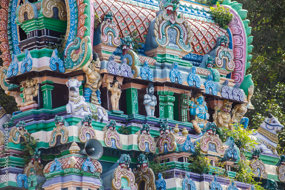 Hindu temple in Tamil Nadu, South India.  Sculptures on Hindu temple gopura (tower)
