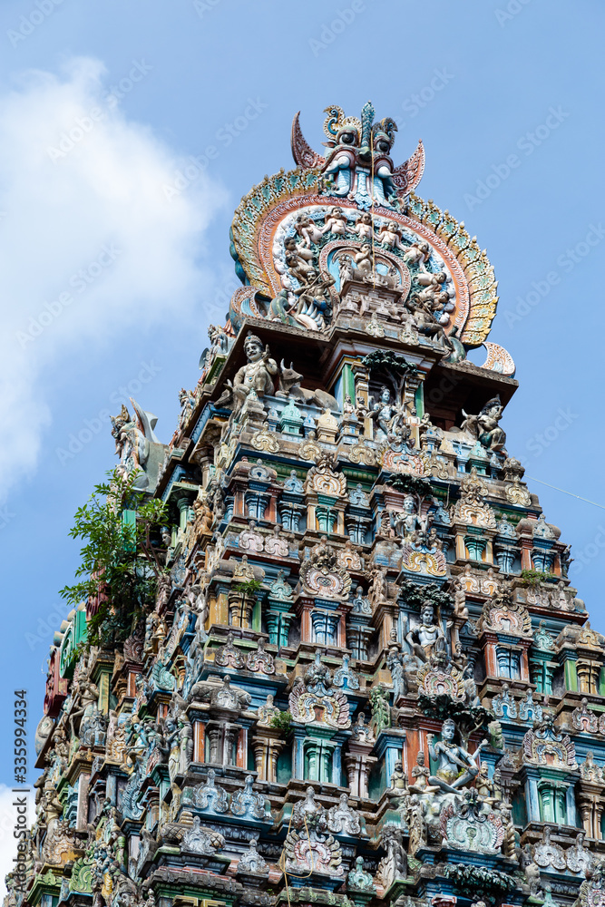 Hindu temple in Tamil Nadu, South India.  Sculptures on Hindu temple gopura (tower)
