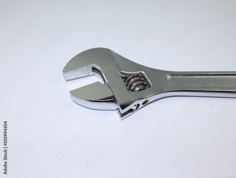 close up shot of adjustable wrench isolated on white background. close up shot of adjustable wrench isolated on white background.