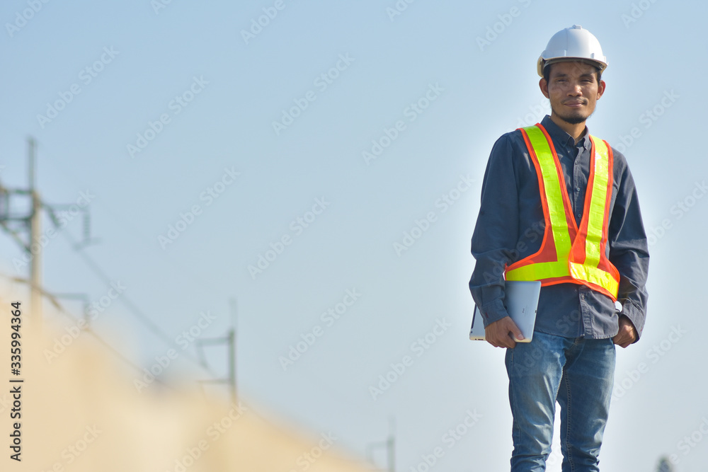 Supervisor construction worker control a on construction site and sunset background Supervisor construction worker control a on construction site and sunset background