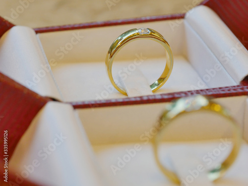 Close-up of two wedding rings placed in a box.